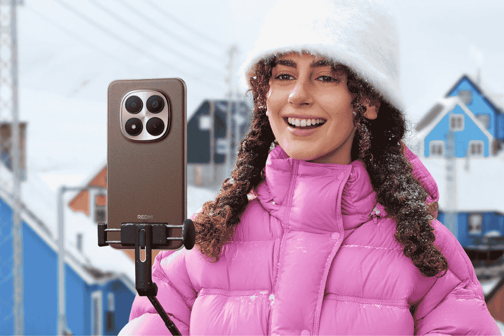 chica en la nieve con el redmi note 15